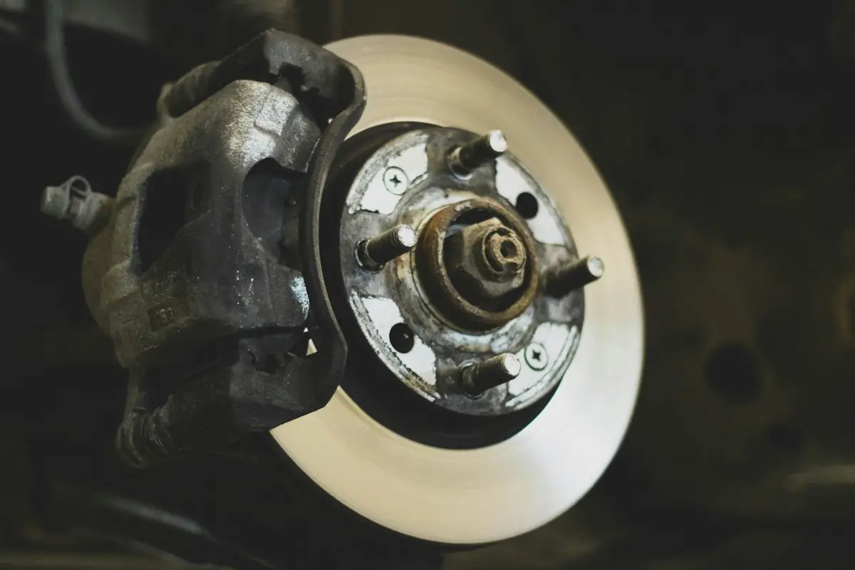 Brake rotor and caliper on a car with the wheel off